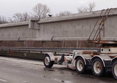 V Van Dyke truck carrying girder